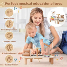 Montessori Music Table wooden instrument set featuring a colorful baby drum by Toyfetti on a white background.