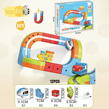 Colorful magnetic toy train track set with curved and straight pieces, a small train, boat, and USB charging cable