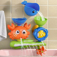 Colorful bath toy set with orange crab, blue whale, green funnel, and water wheels splashing in bathtub