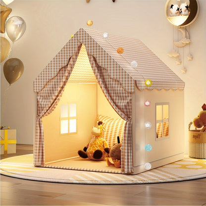 Soft fabric playhouse tent with checkered roof, lit interior, and stuffed animal toys inside on round rug