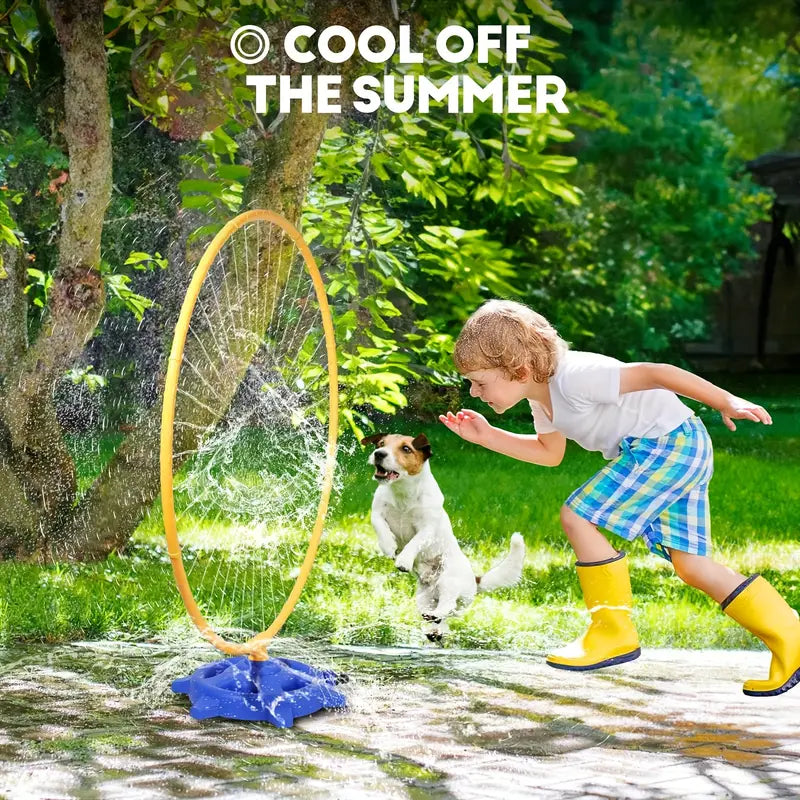 Young boy in yellow rain boots and plaid shorts playing with a small dog near a water sprinkler ring outdoors in sunlight