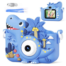 Blue dinosaur-shaped kids camera case with palm trees, clouds, cactus, and included USB cable and lanyard strap