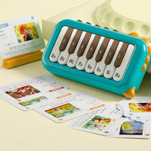 Blue and yellow toy piano keyboard with numbered keys labeled Do, Re, Mi, and illustrated educational cards scattered nearby