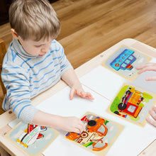 Young child assembling colorful wooden vehicle puzzles on white table with light wooden floor background