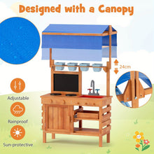 Children's wooden play kitchen with blue adjustable canopy, sink, stove, and blackboard for outdoor use