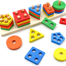 Wooden colorful stacking shapes including hexagon, square, triangle, and circle pieces with pegs on a base board