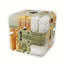 Transparent cube puzzle toy with green, yellow, and white interlocking plastic pieces on white background