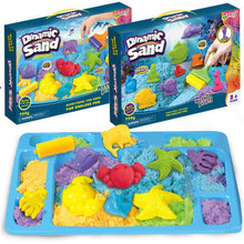 Blue tray with colorful kinetic sand and sea creature molds including crab, starfish, fish, and turtle shapes