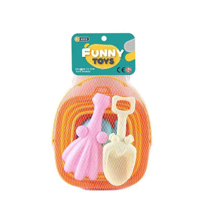 Children’s beach sand play set including pink rake, cream shovel, and orange tray packed in white mesh bag