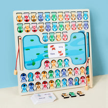 Wooden alphabet fishing game board with colorful fish pieces, magnetic fishing rods, and educational word cards on blue surface