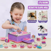 Young girl playing with colorful craft decorations for dolls, backpacks, and keychains on a table