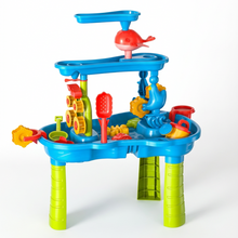Colorful toy water table with various accessories on a white background